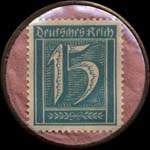 Timbre de 15 pfennig bleu-vert sur fond rose